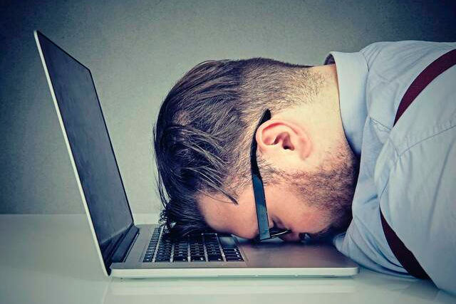 Man with Head in Laptop